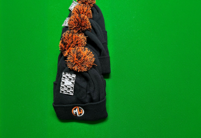 orange black bobble hats